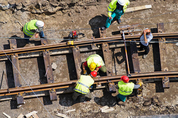 construction workers are building a new railway line